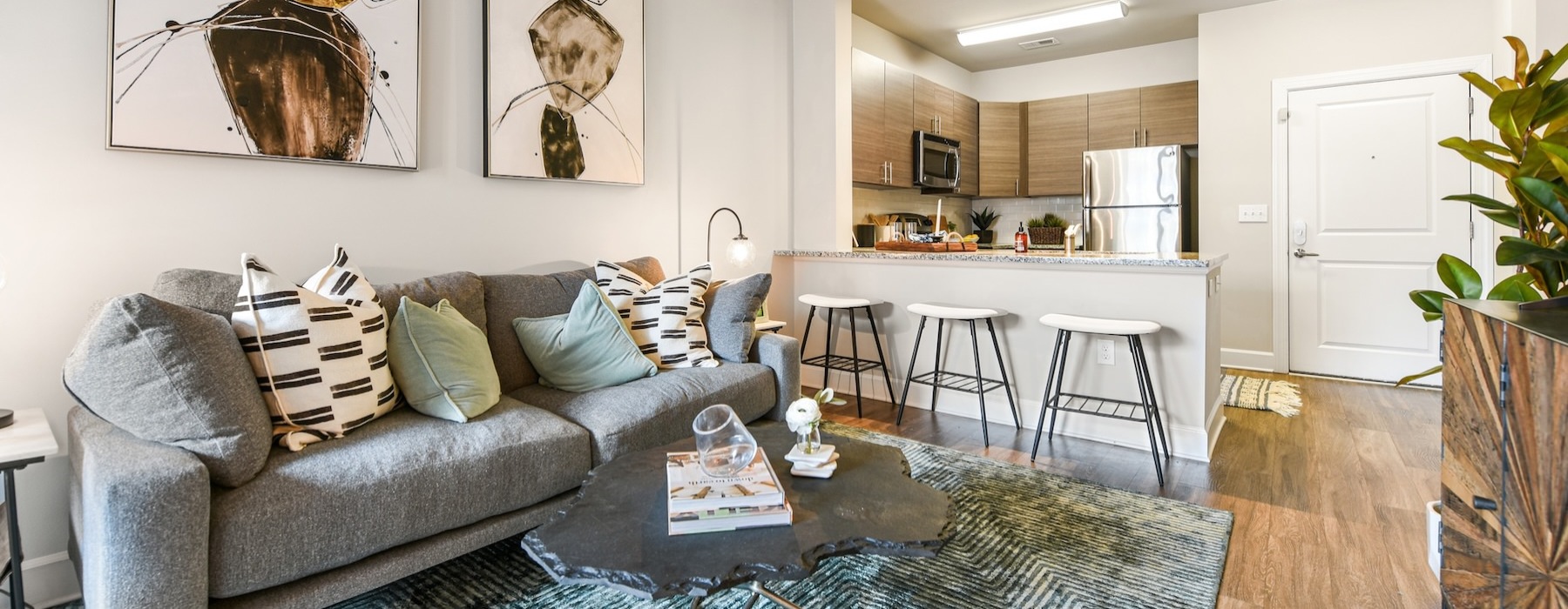 a living room with a couch and chairs